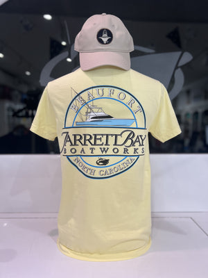 Yellow t-shirt with Jarrett Bay logo and a matching cap on a white surface.